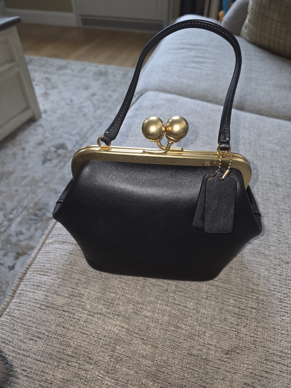Black Leather Top-Handle Bag with Gold Frame
